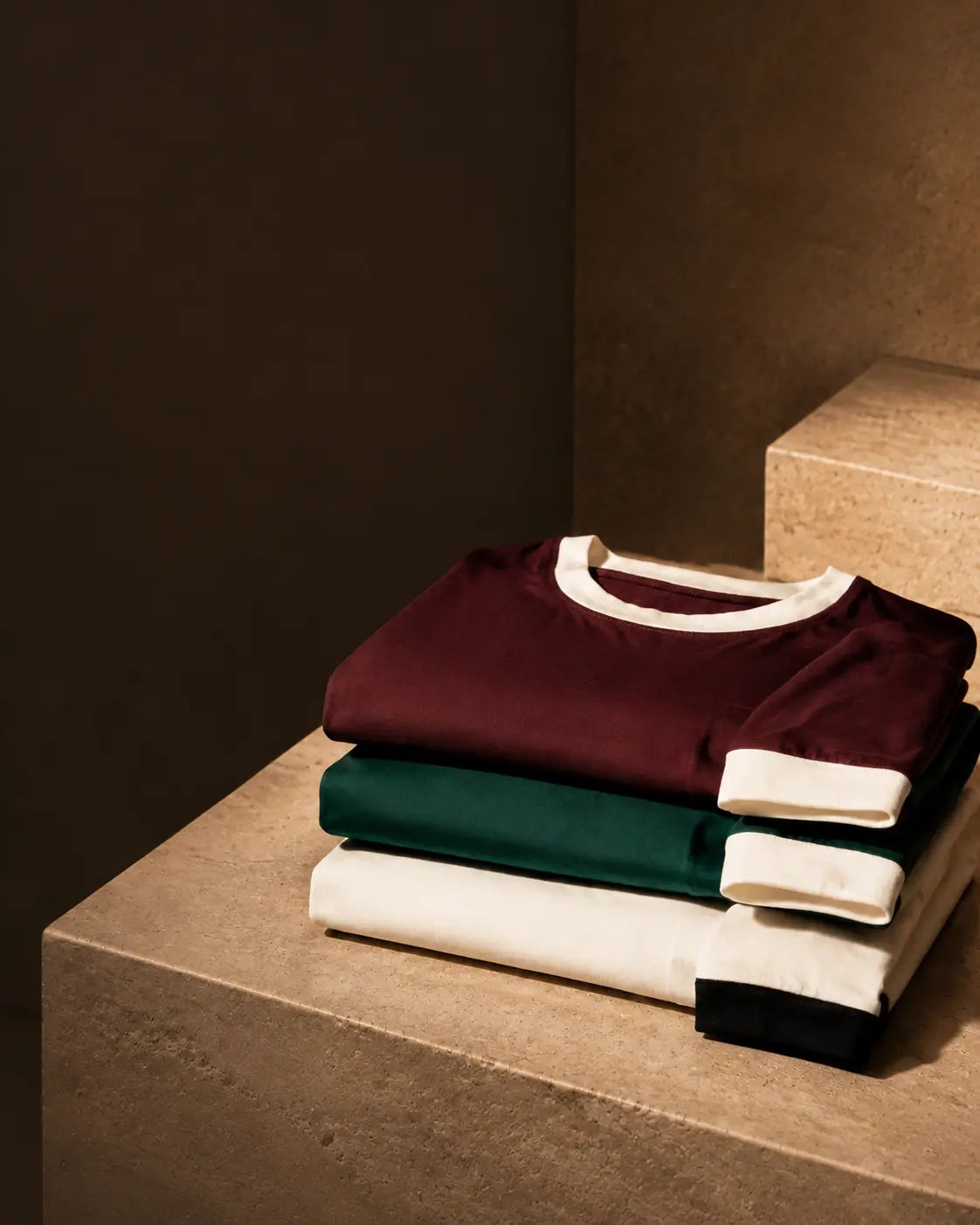 Three folded RIVV Ringer T-Shirts